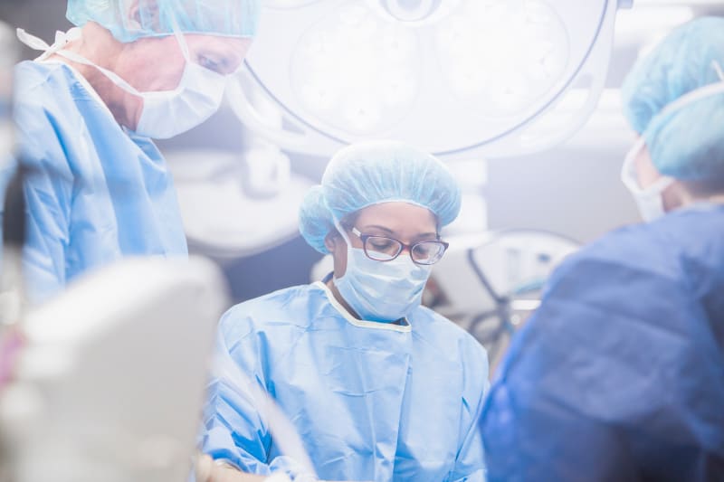 Team of surgeons in operating room.